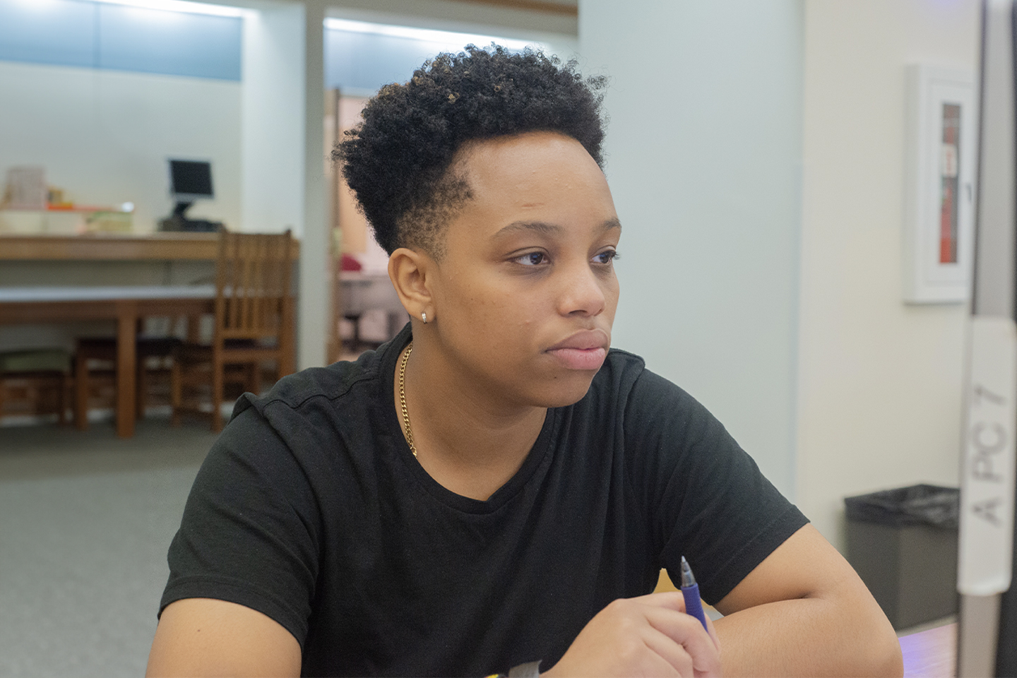 Booth conducting summer research in Trexler Library in 2018